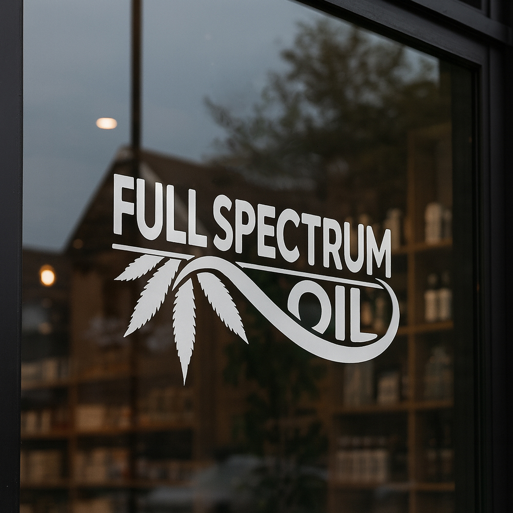 Final logo for Full Spectrum Oil featuring cannabis leaves and a yellow oil curve underlining the bold green lettering